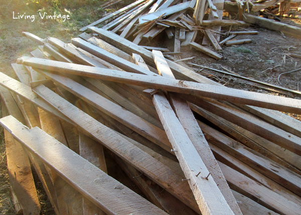 two huge piles of reclaimed wood to de-nail